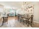 Bright dining room with hardwood and tile floors, and a view of the kitchen at 35 Saddlers Run, Ormond Beach, FL 32174