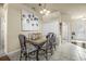 Casual dining area with a glass-top table and wrought iron chairs at 35 Saddlers Run, Ormond Beach, FL 32174