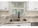 Kitchen sink with granite countertop and a black faucet at 35 Saddlers Run, Ormond Beach, FL 32174