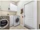 Laundry room with washer, dryer, and ample storage at 35 Saddlers Run, Ormond Beach, FL 32174