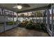 Relaxing screened porch with a stone water feature at 35 Saddlers Run, Ormond Beach, FL 32174