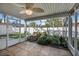 Spacious screened porch with ceiling fan and water feature at 35 Saddlers Run, Ormond Beach, FL 32174