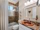 Charming bathroom with a copper sink and glass shower at 38338 Timberlane Dr, Umatilla, FL 32784