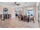 Bright dining room with wooden table and view into living room at 38338 Timberlane Dr, Umatilla, FL 32784