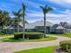 Luxury home with circular drive and palm trees at 38338 Timberlane Dr, Umatilla, FL 32784