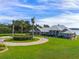 Luxury home with circular drive and palm trees at 38338 Timberlane Dr, Umatilla, FL 32784