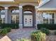 Double front doors and walkway to house entrance at 38338 Timberlane Dr, Umatilla, FL 32784