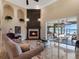 Living room featuring a fireplace and access to a relaxing outdoor space at 38338 Timberlane Dr, Umatilla, FL 32784