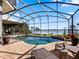 Luxury pool and patio with screened enclosure, perfect for entertaining at 38338 Timberlane Dr, Umatilla, FL 32784