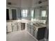 Large bathroom with double vanity, corner sink, and marble floors at 130 Prima Dr, Kissimmee, FL 34759
