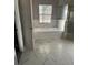Bathroom with a garden tub, shower, and marble tile flooring at 130 Prima Dr, Kissimmee, FL 34759