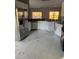 Spacious kitchen featuring stainless steel appliances and marble flooring at 130 Prima Dr, Kissimmee, FL 34759