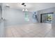 Light-filled living area with tile floors and pool access at 166 Coquina Key Dr, Ormond Beach, FL 32176