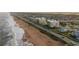 Aerial view of beachfront property and coastal road at 2222 Ocean Shore Blvd # 102B, Ormond Beach, FL 32176