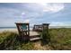 Private beach access with boardwalk and bench at 2222 Ocean Shore Blvd # 102B, Ormond Beach, FL 32176