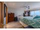 Ocean view bedroom with king-size bed and ceiling fan at 2222 Ocean Shore Blvd # 102B, Ormond Beach, FL 32176