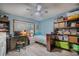 Cozy bedroom with built-in shelving and workspace at 2222 Ocean Shore Blvd # 102B, Ormond Beach, FL 32176