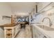 Open concept kitchen with island and stainless steel appliances at 2222 Ocean Shore Blvd # 102B, Ormond Beach, FL 32176