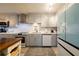 Updated kitchen, gray cabinets, white countertops and island at 2222 Ocean Shore Blvd # 102B, Ormond Beach, FL 32176