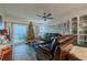 Living room with leather furniture, Christmas tree, and ocean view at 2222 Ocean Shore Blvd # 102B, Ormond Beach, FL 32176