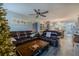 Open living room and kitchen with leather sofas and wooden coffee table at 2222 Ocean Shore Blvd # 102B, Ormond Beach, FL 32176