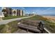 Wooden bench overlooking the road and beach at 2222 Ocean Shore Blvd # 102B, Ormond Beach, FL 32176