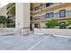 Condominium parking lot with access to building entrance at 2222 Ocean Shore Blvd # 102B, Ormond Beach, FL 32176