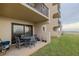 Private patio with table and chairs, overlooking ocean at 2222 Ocean Shore Blvd # 102B, Ormond Beach, FL 32176