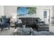 Living room features a sectional sofa and stylish decor at 231 Riverside Dr # 1604-1, Daytona Beach, FL 32117