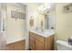 Simple half bathroom with wood vanity and tiled floor at 33 Sea Gull Dr, Ormond Beach, FL 32176