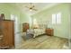 Guest bedroom with wood floors and coastal mural at 33 Sea Gull Dr, Ormond Beach, FL 32176