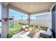 Relaxing backyard patio with seating and landscaping at 4247 Little Owl Ln, Kissimmee, FL 34746