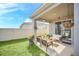 Covered patio furniture in backyard setting at 4247 Little Owl Ln, Kissimmee, FL 34746