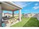 Spacious backyard with patio furniture and grill at 4247 Little Owl Ln, Kissimmee, FL 34746