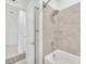 Clean bathroom with tile shower and bathtub at 4247 Little Owl Ln, Kissimmee, FL 34746