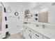 Nautical-themed bathroom with white vanity and navy blue accents at 4247 Little Owl Ln, Kissimmee, FL 34746