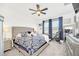 Spacious bedroom with king-size bed, exercise bike, and ample closet space at 4247 Little Owl Ln, Kissimmee, FL 34746