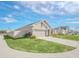 New home showcasing side elevation, landscaping, and a privacy fence at 4247 Little Owl Ln, Kissimmee, FL 34746