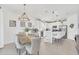 Modern kitchen with white cabinets, an island, and stainless steel appliances at 4247 Little Owl Ln, Kissimmee, FL 34746