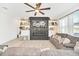 Gathering room features a fireplace, sectional sofa, and built-ins at 4247 Little Owl Ln, Kissimmee, FL 34746