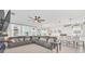 Open living space with sectional sofa, fireplace and kitchen views at 4247 Little Owl Ln, Kissimmee, FL 34746