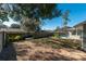Landscaped backyard with spacious lawn at 5700 E Fort King St, Ocala, FL 34470