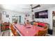 Bright dining room with a large table, six chairs, and access to a patio at 5700 E Fort King St, Ocala, FL 34470