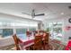 Spacious dining area with a large table, six chairs, and views of the pool at 5700 E Fort King St, Ocala, FL 34470