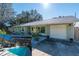 Exterior home view includes front entrance, garage, landscaping, and the pool is shown in a smaller inset at 5700 E Fort King St, Ocala, FL 34470