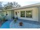 Front door entrance with walkway and landscaping at 5700 E Fort King St, Ocala, FL 34470