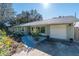 Cute light green house with landscaped yard at 5700 E Fort King St, Ocala, FL 34470