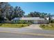 Light green house with a spacious yard at 5700 E Fort King St, Ocala, FL 34470