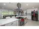 Modern kitchen with white cabinets and large island at 5700 E Fort King St, Ocala, FL 34470