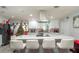 Modern kitchen with white cabinets, large island, and stainless steel appliances at 5700 E Fort King St, Ocala, FL 34470
